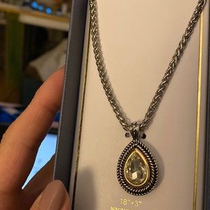 Pretty necklace set with clear stones pear shaped and has earrings matching New